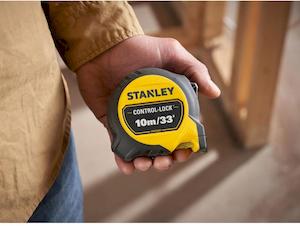Рулетка вимірювальна CONTROL-LOCK довжиною 10 м/33, шириною 25 мм, в обгумованому корпусі, з подвійною шкалою STANLEY STHT37237-5 - картинка №6 Фото №6 - Рулетка вимірювальна CONTROL-LOCK довжиною 10 м/33, шириною 25 мм, в обгумованому корпусі, з подвійною шкалою STANLEY STHT37237-5